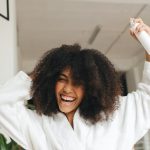 woman holding a hair spray